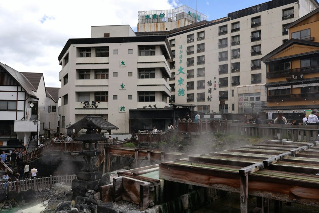 Traditional Japanese hot spring onsen with steam rising, ideal for family ryokan stays near Tokyo