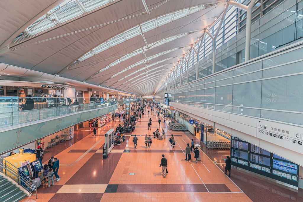 Interior of a Japanese airport terminal with travelers
