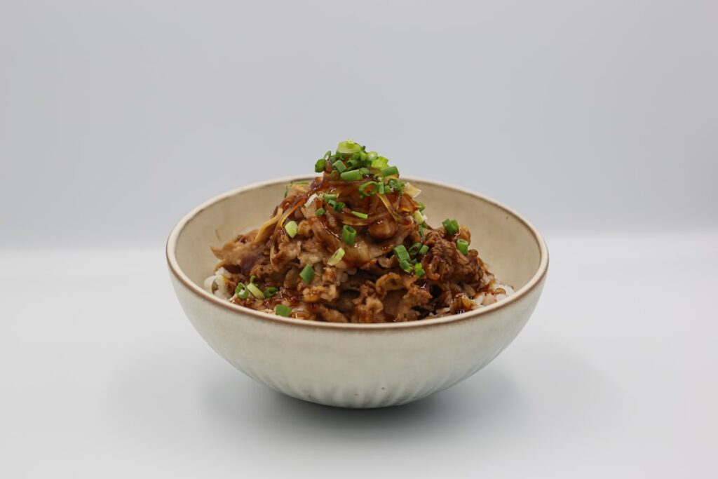 A bowl of Japanese gyudon, simmered beef and onion over rice